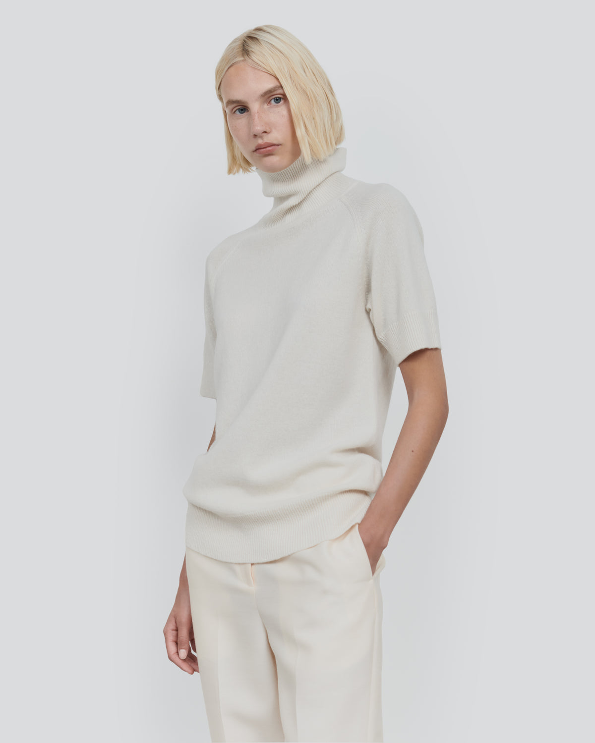 ESSENTIAL WOOL SHORT SLEEVE TURTLENECK in Ecru - close-up #colour_Ecru